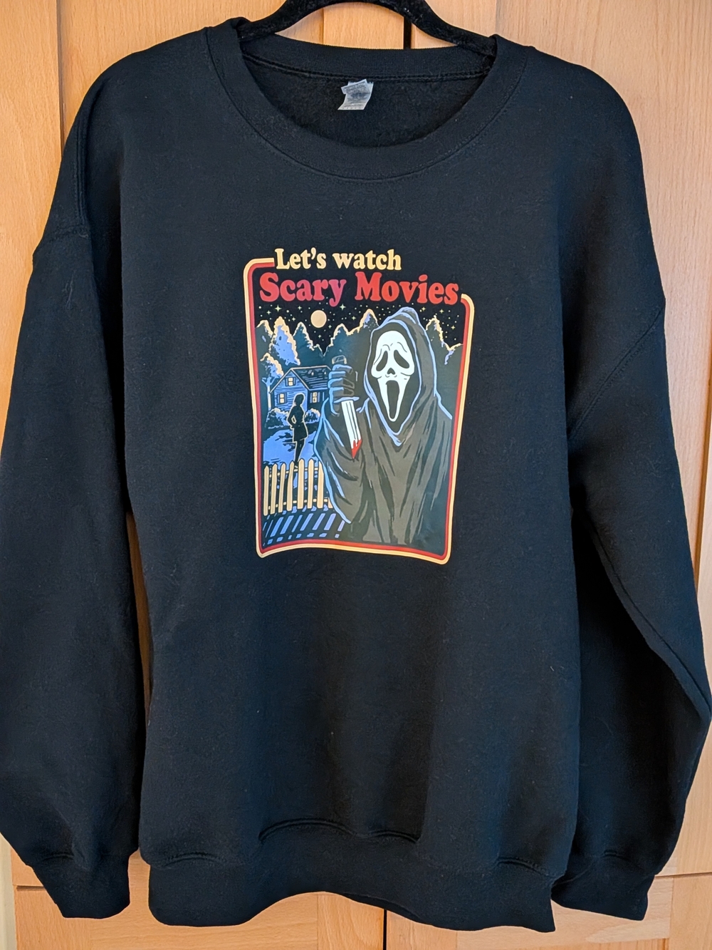 Let's Watch Scary Movies Black Graphic Crewneck Sweater